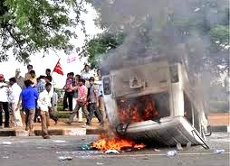 angry agitators burning vehicles