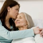 the daughter (L) hugging her sick mother