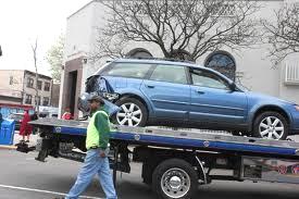 a lemon (faulty car) being towed
