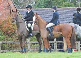 liverymen on horses at a livery yard/stables, London