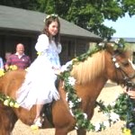 a May Queen on a horse