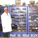 a mineralogist with some of his prized mineral samples