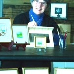 Joan Kelly of Tasmania, a popular miniaturist, with her miniatures