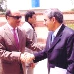a newcomer (R) being received into the club/association