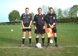 sports officials -- referees of a football/soccer match