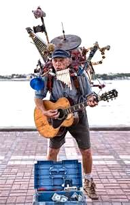 one-man band, playing several music instruments