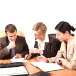 legal representatives of a company inspecting a deal document