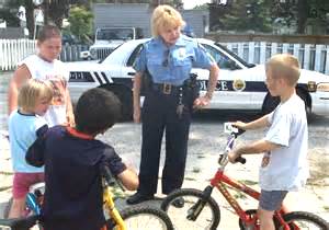 a female police sergeant having serious talk with the kids
