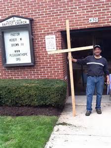 a saxton at the entrance of his church