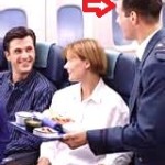 a flight steward attending passengers