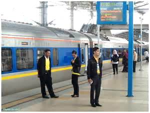 train stewards (in yellow shirts) Japan
